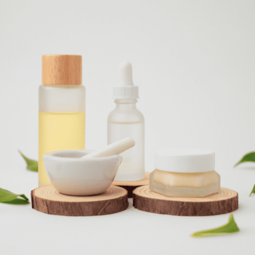 Skin care with pastel and mortar on wooden podium with natural leaf on the way background